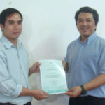 Course participant receiving CF certficate from Prof Monchai at conclusion of course.